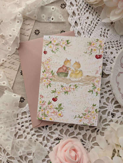 Carte pliée "Les Amoureux du Cerisier" Cosy Del Cottage